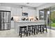 Modern kitchen with stainless steel appliances and island seating at 3543 Woodmont Dr, Parrish, FL 34219