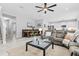 Open living room and kitchen with large sectional sofa at 3543 Woodmont Dr, Parrish, FL 34219