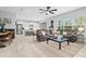 Open concept living area with large sectional sofa and kitchen views at 3543 Woodmont Dr, Parrish, FL 34219