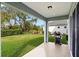 Covered patio with built-in grill and backyard access at 3543 Woodmont Dr, Parrish, FL 34219