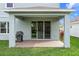 Covered patio with grilling station and sliding glass doors at 3543 Woodmont Dr, Parrish, FL 34219