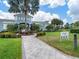 Community recreation center with landscaping and walkway at 3543 Woodmont Dr, Parrish, FL 34219