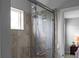 Bright shower with double shower heads at 3543 Woodmont Dr, Parrish, FL 34219