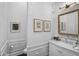 Elegant bathroom with white vanity and marble countertop at 370 Sugar Mill Dr, Osprey, FL 34229