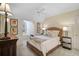 Cozy bedroom featuring a wicker bed frame and window seat at 370 Sugar Mill Dr, Osprey, FL 34229