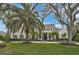 Stunning two-story home with lush landscaping and a stately facade at 370 Sugar Mill Dr, Osprey, FL 34229