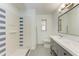 Updated bathroom with double vanity and walk-in shower at 390 301 W Blvd # 8C, Bradenton, FL 34205