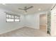 Comfortable bedroom, featuring wood-look floors and a ceiling fan at 390 301 W Blvd # 8C, Bradenton, FL 34205