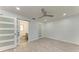 Spacious bedroom featuring wood-look floors and an ensuite bathroom at 390 301 W Blvd # 8C, Bradenton, FL 34205