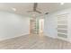 Light and airy bedroom with a barn door and ensuite bathroom at 390 301 W Blvd # 8C, Bradenton, FL 34205