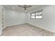 Bright bedroom with ceiling fan and wood-look floors at 390 301 W Blvd # 8C, Bradenton, FL 34205