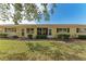 Rear view of condo showing screened patio and landscaping at 390 301 W Blvd # 8C, Bradenton, FL 34205