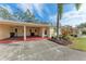 Single-story home with carport and landscaped yard at 390 301 W Blvd # 8C, Bradenton, FL 34205