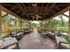 Relaxing gazebo with seating overlooking a pond at 390 301 W Blvd # 8C, Bradenton, FL 34205