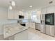 Modern kitchen with stainless steel appliances and granite countertops at 390 301 W Blvd # 8C, Bradenton, FL 34205