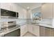 Renovated kitchen, showcasing granite countertops and stainless steel appliances at 390 301 W Blvd # 8C, Bradenton, FL 34205