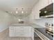 Eat-in kitchen with granite island and stainless steel appliances at 390 301 W Blvd # 8C, Bradenton, FL 34205