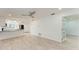 Open living room with wood-look flooring and ceiling fan at 390 301 W Blvd # 8C, Bradenton, FL 34205