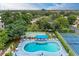 Relaxing kidney-shaped pool with shuffleboard and tennis courts at 390 301 W Blvd # 8C, Bradenton, FL 34205
