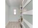 Well-lit storage room with shelving and vinyl flooring at 390 301 W Blvd # 8C, Bradenton, FL 34205