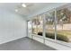 Sunroom featuring tile floors and view of backyard at 390 301 W Blvd # 8C, Bradenton, FL 34205