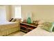 Cozy bedroom with twin beds, and coastal decor at 3907 10Th Avenue W Dr, Bradenton, FL 34205