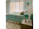 Bedroom with teal bedding and ocean decor at 3907 10Th Avenue W Dr, Bradenton, FL 34205