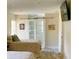 Guest bedroom with twin beds and barn door entry at 3907 10Th Avenue W Dr, Bradenton, FL 34205