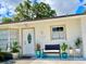 Inviting front entrance with porch and landscaping at 3907 10Th Avenue W Dr, Bradenton, FL 34205