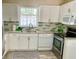 Well-equipped kitchen with white cabinets and new appliances at 3907 10Th Avenue W Dr, Bradenton, FL 34205