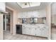 Kitchen with white cabinets, sink, and dishwasher at 4278 Mundella Cir, Port Charlotte, FL 33948