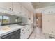 Kitchen with white cabinets and a view to outside at 4278 Mundella Cir, Port Charlotte, FL 33948