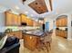 Island kitchen with wood cabinets and granite countertops at 4679 Tuscana Dr, Sarasota, FL 34241