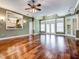 Spacious living room with hardwood floors, high ceilings, and a view of the kitchen at 4841 Edgemont Ct, Sarasota, FL 34233