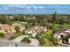 Aerial view showcasing homes in a golf community, with a beautiful golf course and lush landscaping at 5245 88Th E St, Bradenton, FL 34211