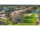 Aerial view of the golf course community, with lush green fairways and glistening lakes at 5245 88Th E St, Bradenton, FL 34211