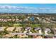 Rosedale community aerial showcasing well-manicured lawns, mature trees, and sparkling lakes under a sunny sky at 5245 88Th E St, Bradenton, FL 34211