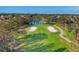Aerial view of golf course with winding paths, pristine greens, and calm water features at 5245 88Th E St, Bradenton, FL 34211