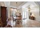 Bright dining room with a decorative chandelier and views of the outdoors at 5245 88Th E St, Bradenton, FL 34211