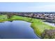 Picture of golf course, with scenic water hazards and lush greens, surrounded by beautiful homes at 5245 88Th E St, Bradenton, FL 34211
