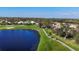 Scenic view of golf course and pond, featuring golf carts on the cart path and lush green landscape at 5245 88Th E St, Bradenton, FL 34211