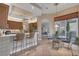 Open floor plan of the kitchen with breakfast bar, tile floors, and eat-in dining area at 5245 88Th E St, Bradenton, FL 34211