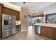 Bright kitchen with stainless steel appliances, breakfast bar and access to the pool area at 5245 88Th E St, Bradenton, FL 34211