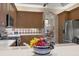 Kitchen with stainless steel appliances and custom cabinetry at 5245 88Th E St, Bradenton, FL 34211