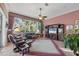Comfortable living room with large windows and views of lush greenery at 5245 88Th E St, Bradenton, FL 34211