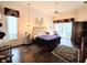 Large main bedroom with wood floors and access to pool at 5245 88Th E St, Bradenton, FL 34211