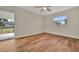 Bright bedroom with hardwood floors and sliding door at 5411 16Th W St, Bradenton, FL 34207