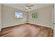 Spacious bedroom with hardwood floors and ceiling fan at 5411 16Th W St, Bradenton, FL 34207