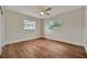 Spacious bedroom with hardwood floors and ceiling fan at 5411 16Th W St, Bradenton, FL 34207