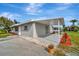 Single story home with covered patio and landscaped yard at 5411 16Th W St, Bradenton, FL 34207